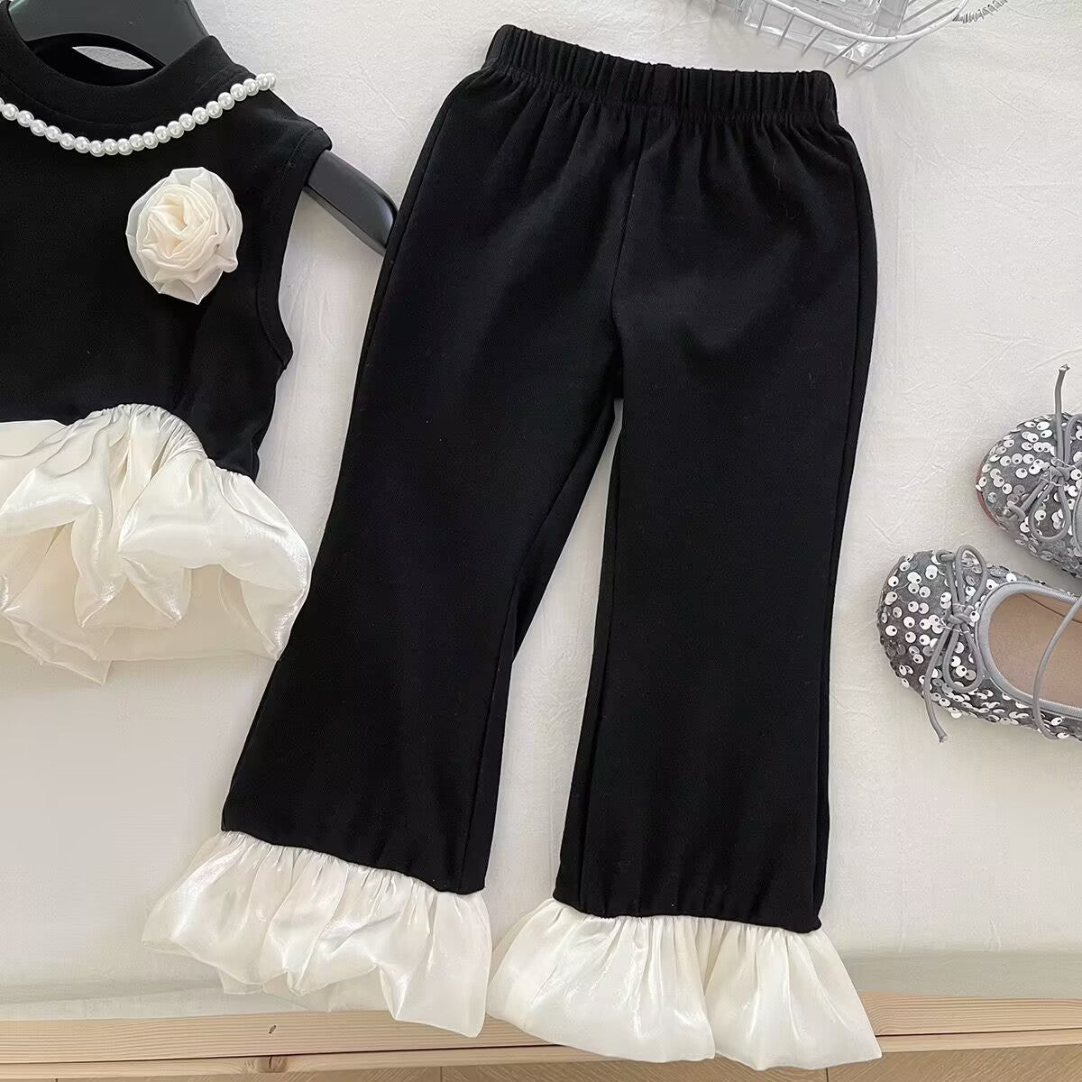 Black and White Ruffle Top and Flared Pants Set – TYM-YWL-004